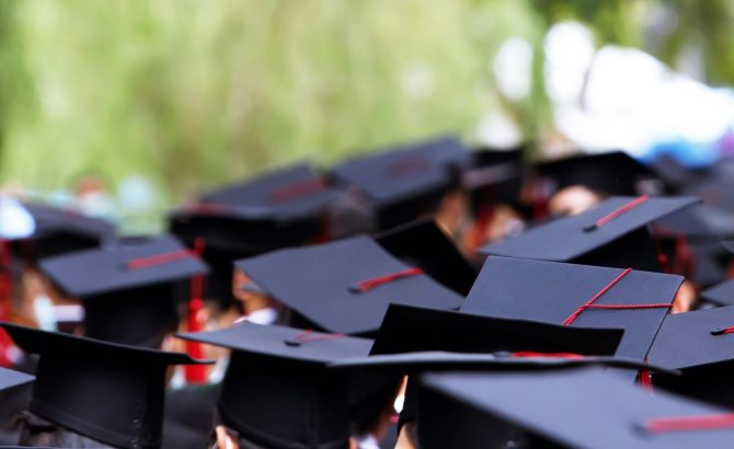 Graduates receive a certificate at the university